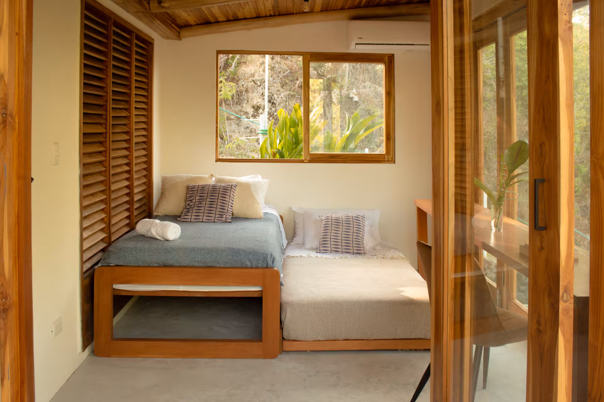 The third bedroom — built as a workspace with a wide desk for two