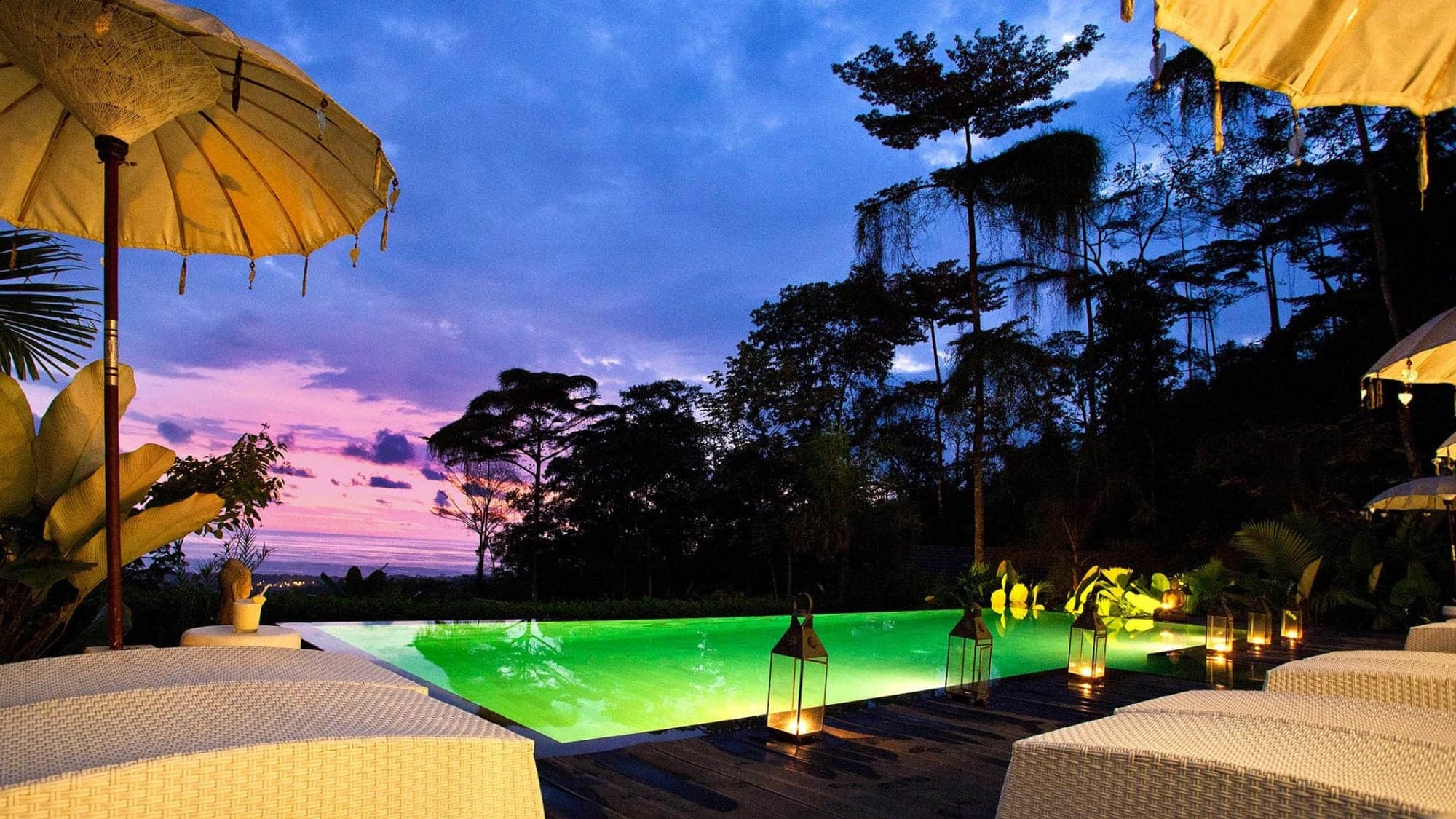 Lit-up infinity pool at twilight, the trip you'll remember